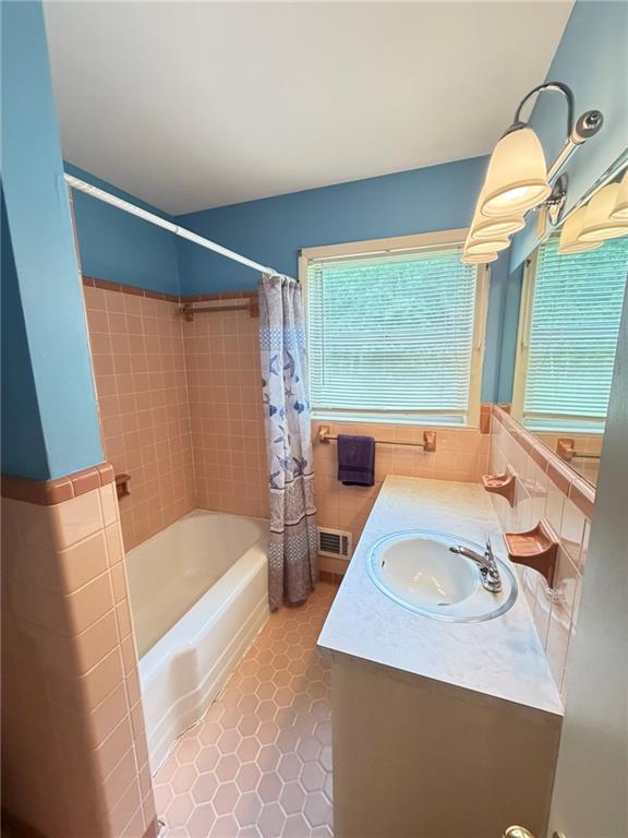 52 Lyons Drive Northwest Rome, GA 30165 - Photo 16 of 34 a bathroom with a sink a bathtub and a window