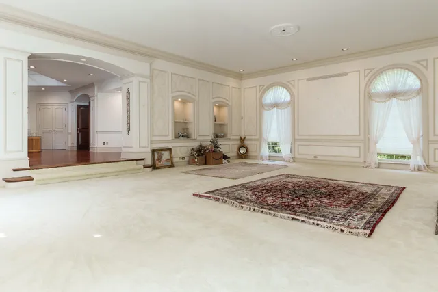 a kitchen with stainless steel appliances granite countertop a refrigerator and a stove