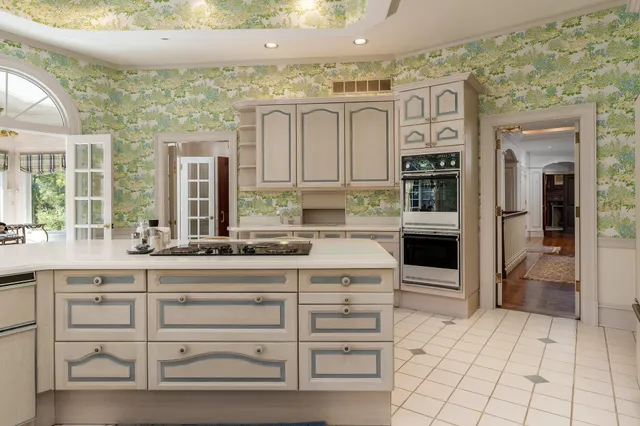 a view of a livingroom with a fireplace and a large window