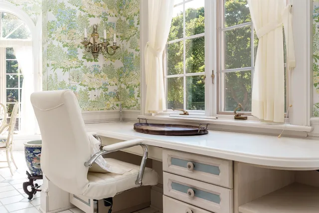 a view of room with walk in closet with empty racks