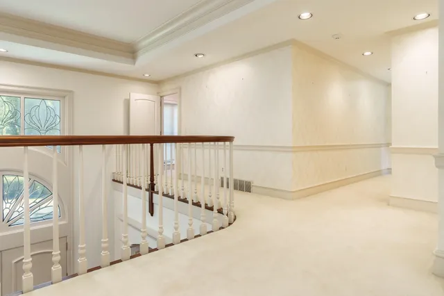 a view of a room with wooden floor and fence