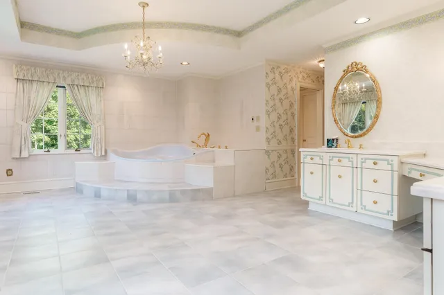 a aerial view of a house with yard swimming pool and outdoor seating