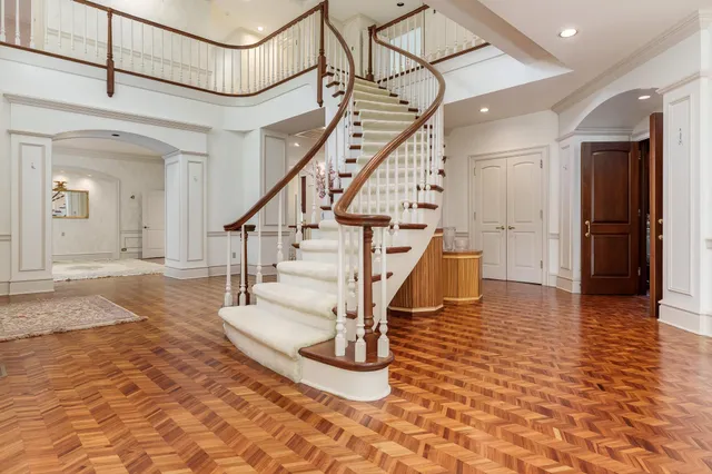 a living room with furniture a window and a fireplace