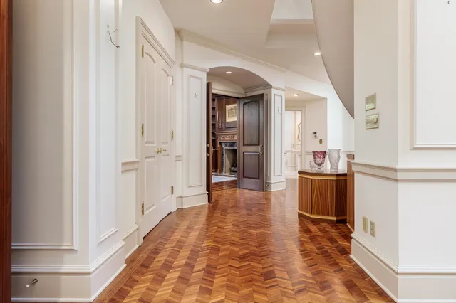 a living room with furniture a rug and a fireplace