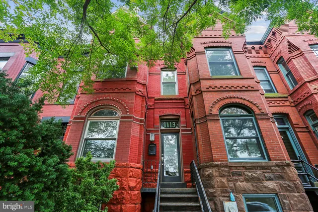 aerial view of a brick building with large windows