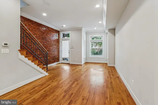 a view of entryway with wooden floor