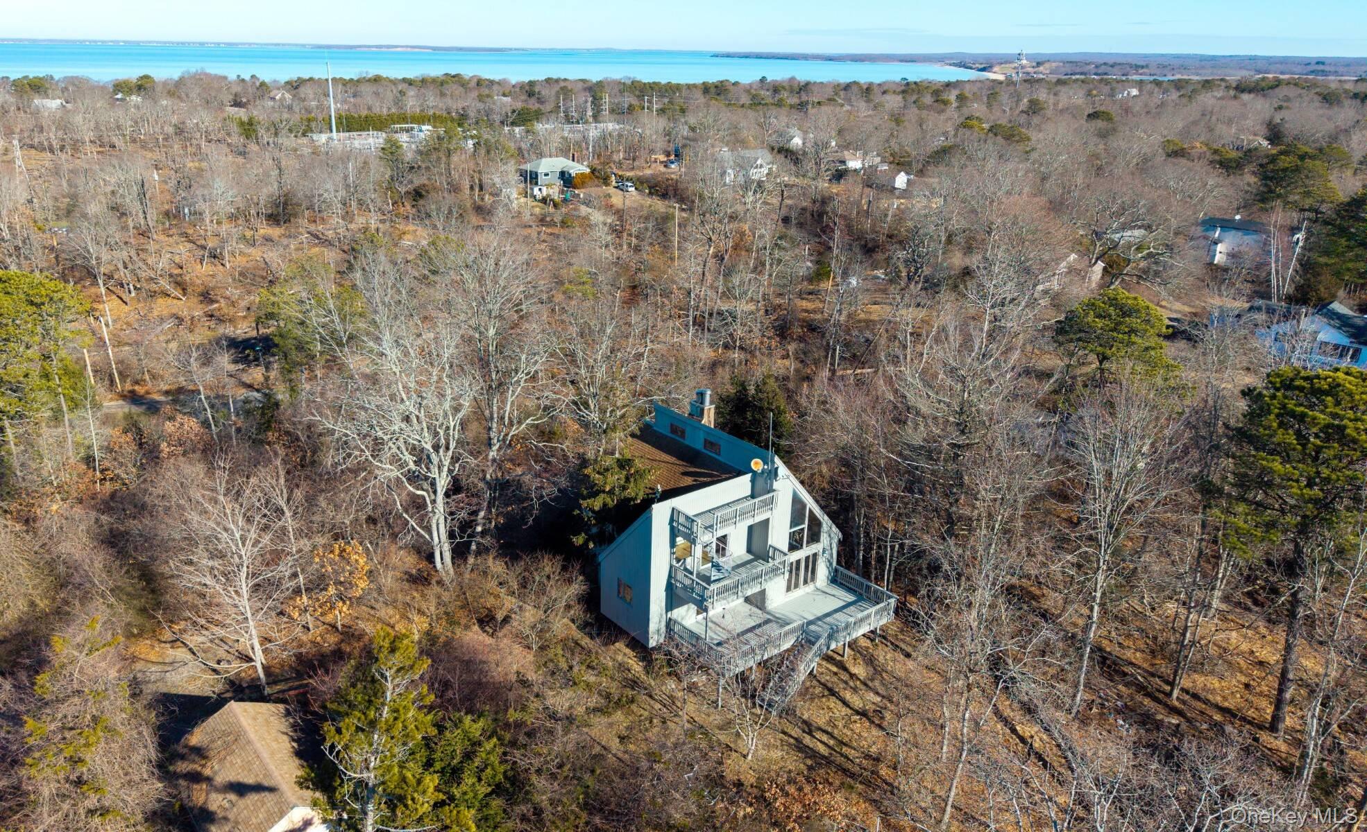 32 Old Canoe Place Road Hampton Bays, NY 11946 - Photo 4 of 12 a view of outdoor space and city view