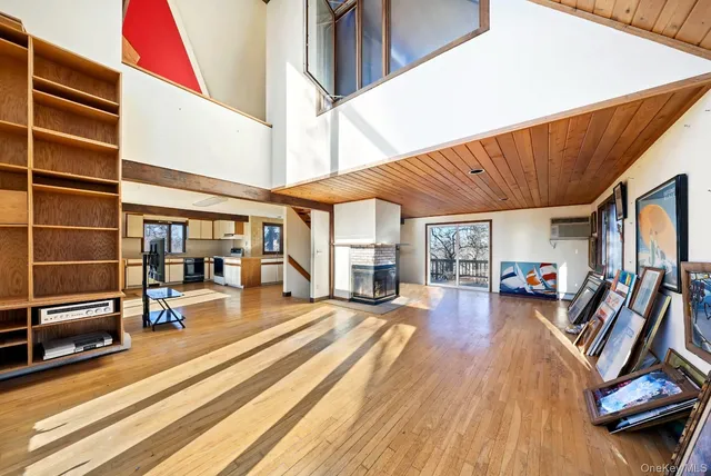 a view of a patio with table and chairs with wooden floor and fence