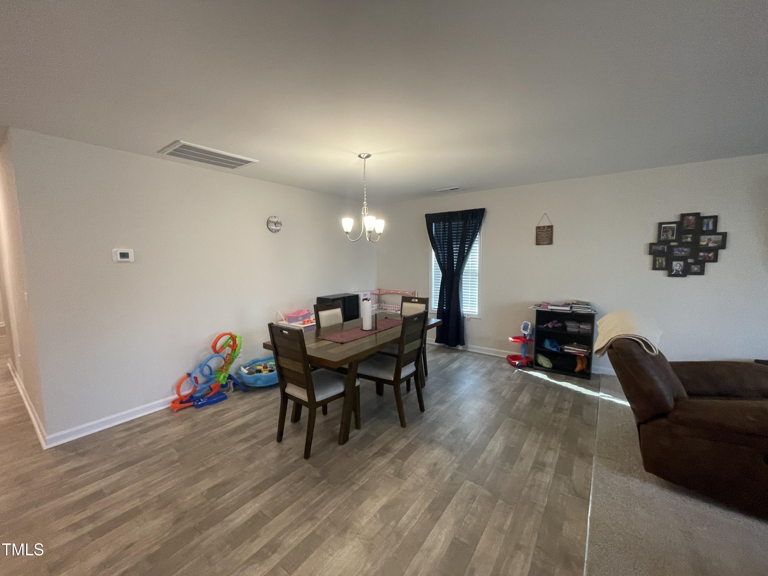 195 Presley Street Raeford, NC 28376 - Photo 17 of 37 a living room with furniture and a wooden floor