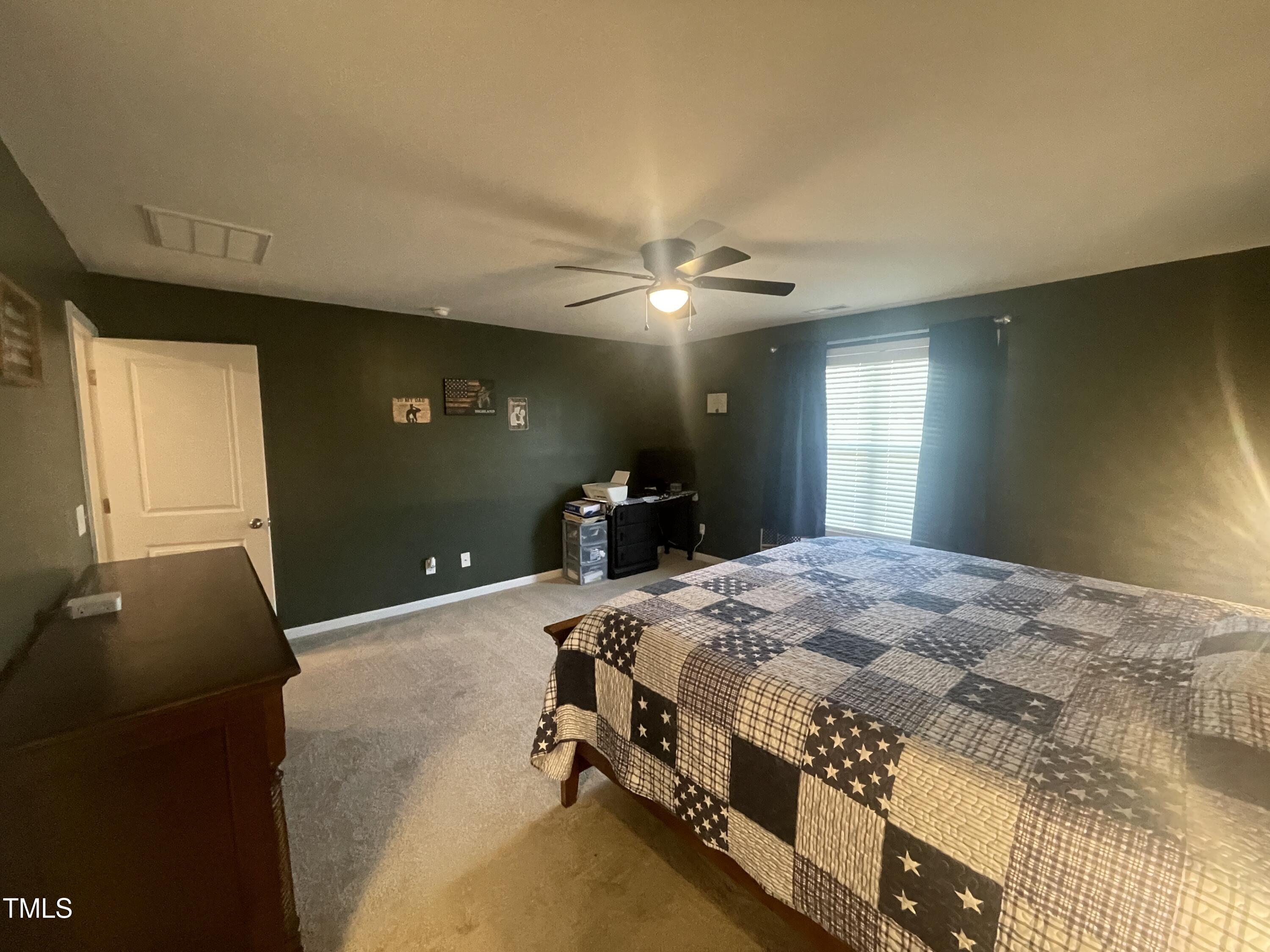 195 Presley Street Raeford, NC 28376 - Photo 19 of 37 a bedroom with a bed and window