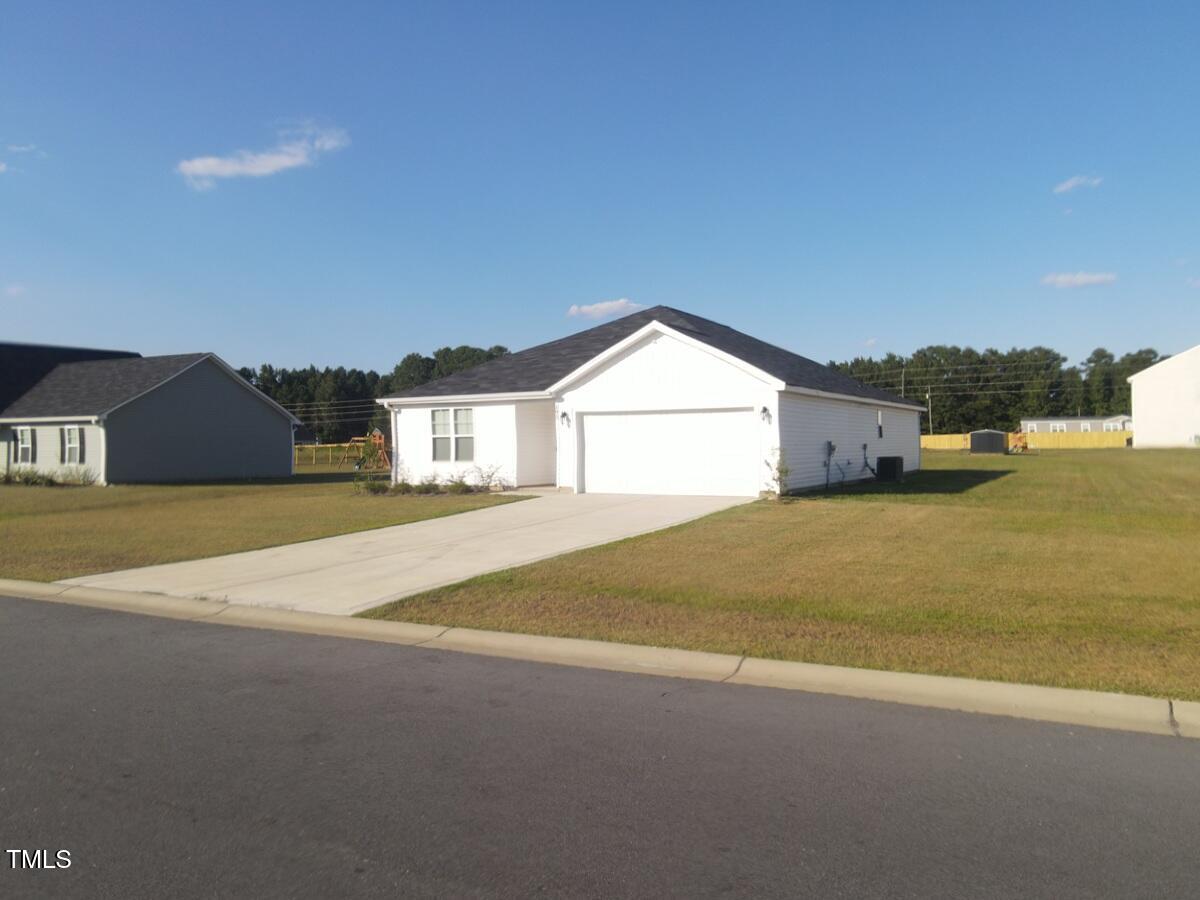 195 Presley Street Raeford, NC 28376 - Photo 2 of 37 a view of a house with a yard