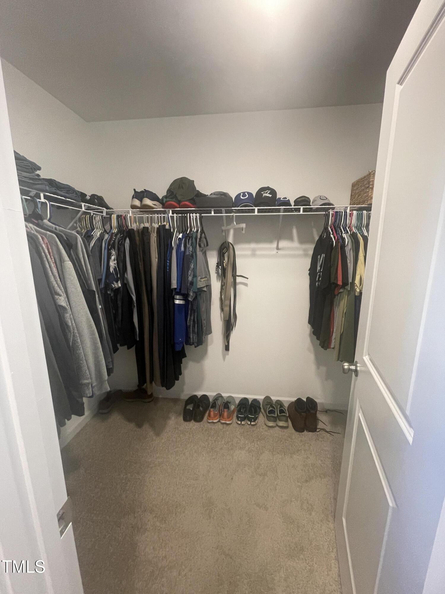 195 Presley Street Raeford, NC 28376 - Photo 24 of 37 a view of walk in closet with clothes and shoes