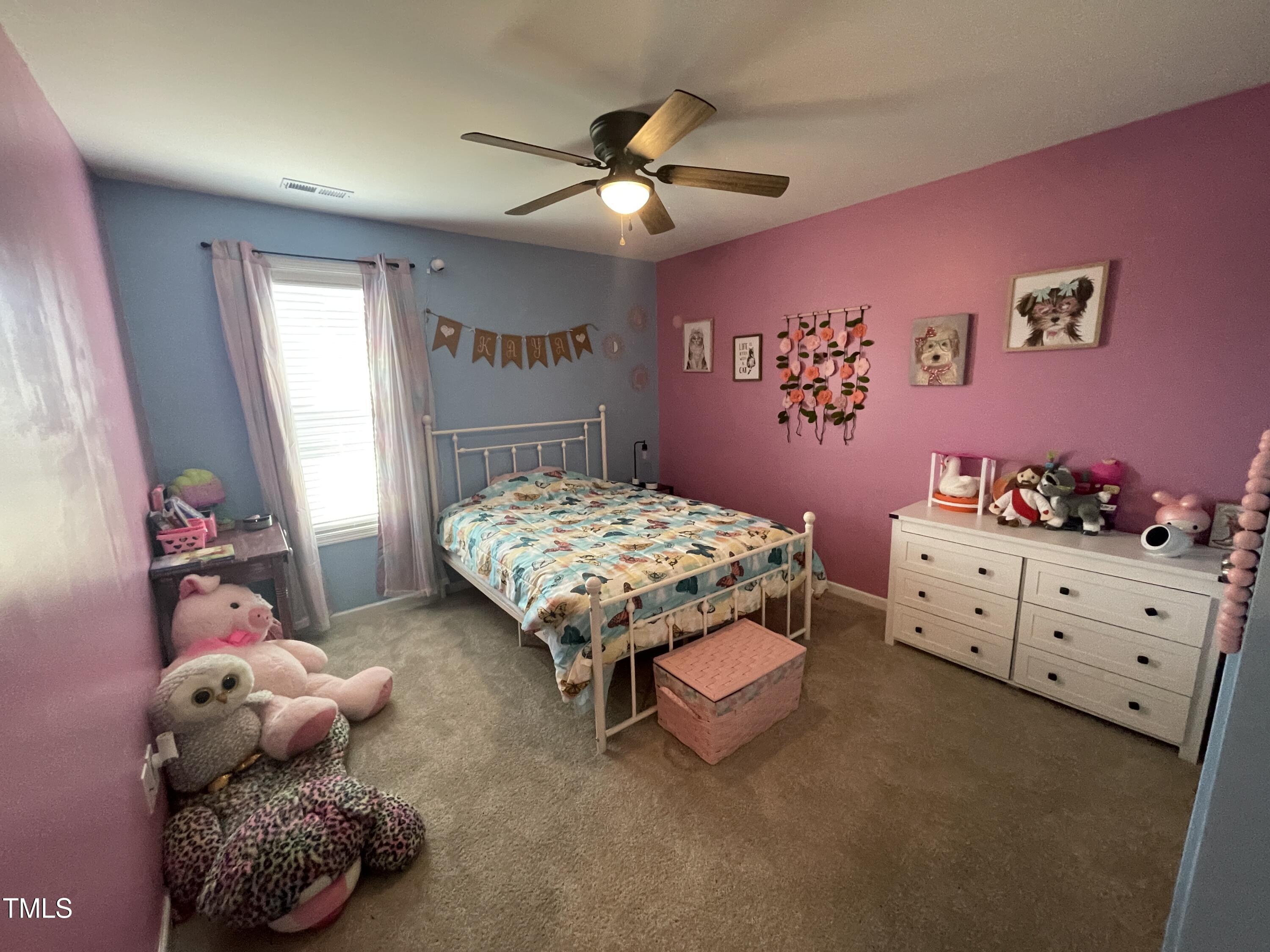 195 Presley Street Raeford, NC 28376 - Photo 27 of 37 a bedroom with a bed and a window