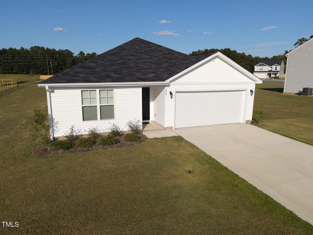 195 Presley Street Raeford, NC 28376 - Photo 3 of 37 a front view of a house with a yard