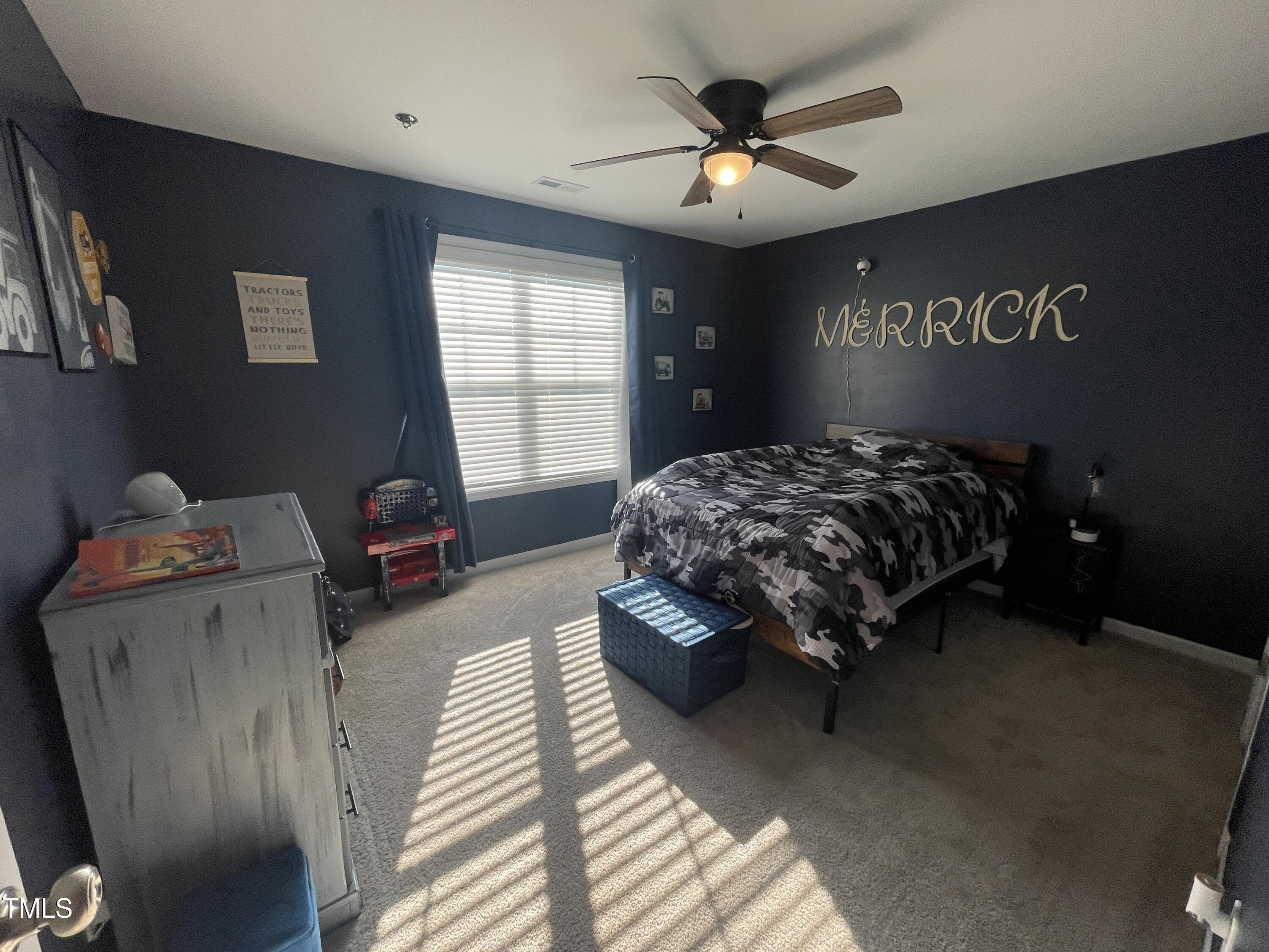 195 Presley Street Raeford, NC 28376 - Photo 31 of 37 a bedroom with a bed and window