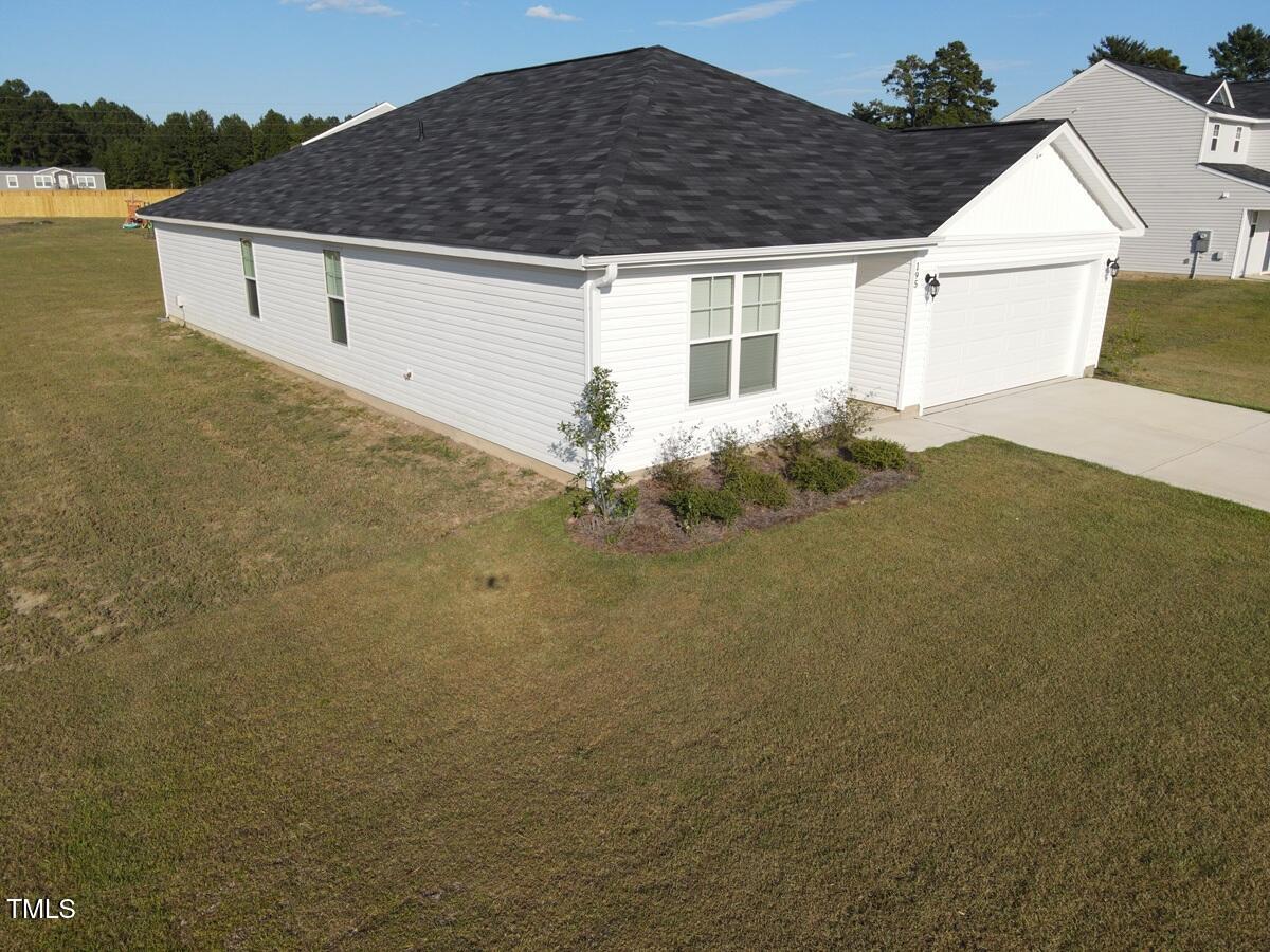 195 Presley Street Raeford, NC 28376 - Photo 5 of 37 a house view with a backyard