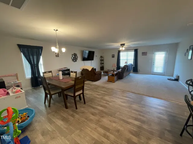a kitchen with a sink a counter and cabinets