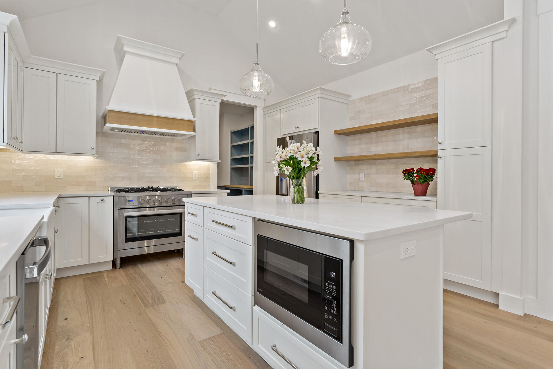 99 Orchard Road Mashpee, MA 02649 - Photo 14 of 49 a kitchen with granite countertop a stove a sink and a refrigerator