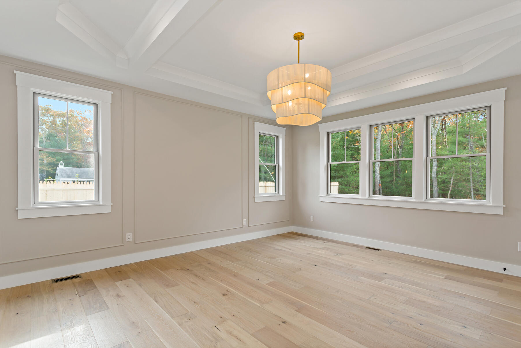 99 Orchard Road Mashpee, MA 02649 - Photo 23 of 49 a view of an empty room with wooden floor and a window
