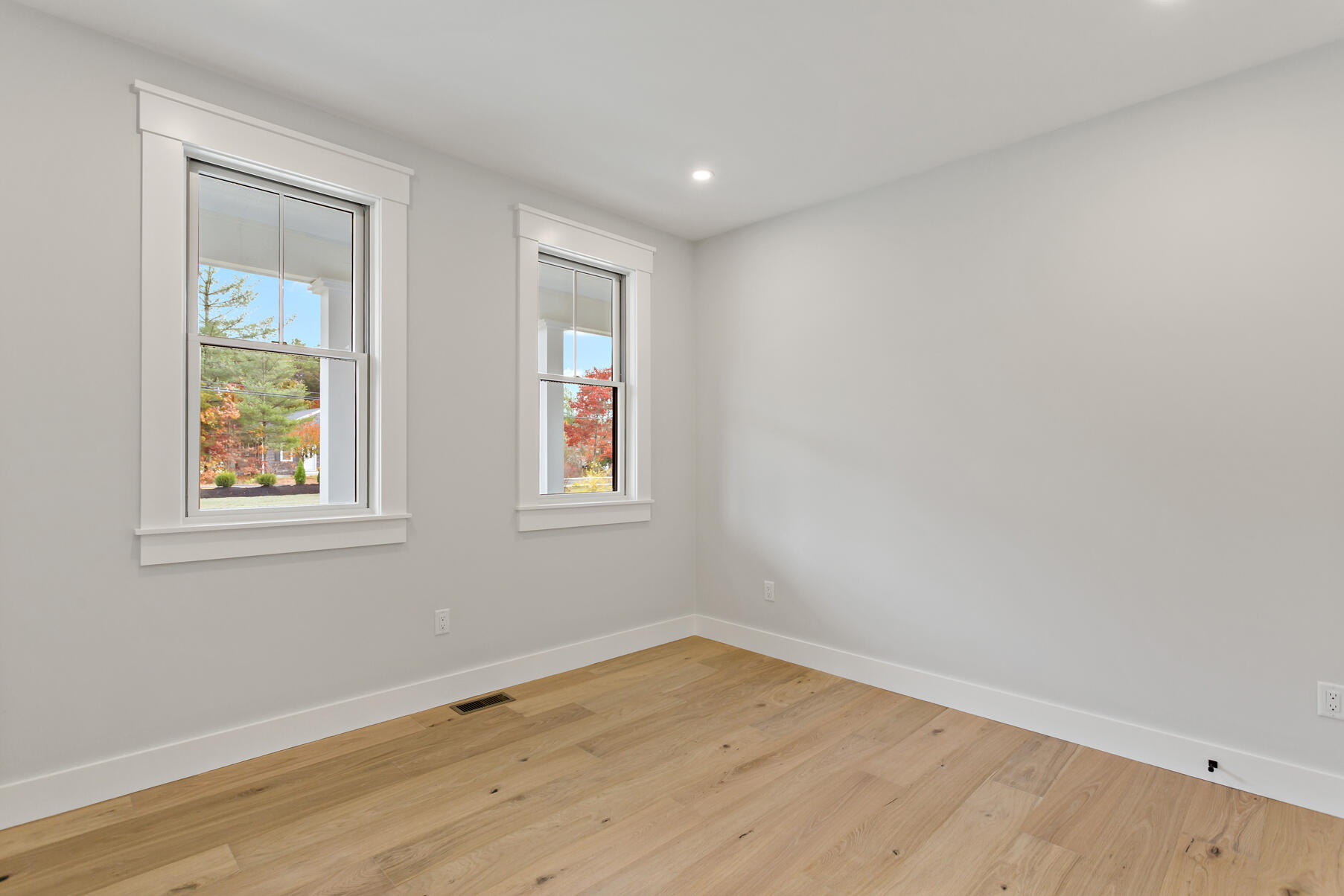 99 Orchard Road Mashpee, MA 02649 - Photo 30 of 49 an empty room with wooden floor and windows