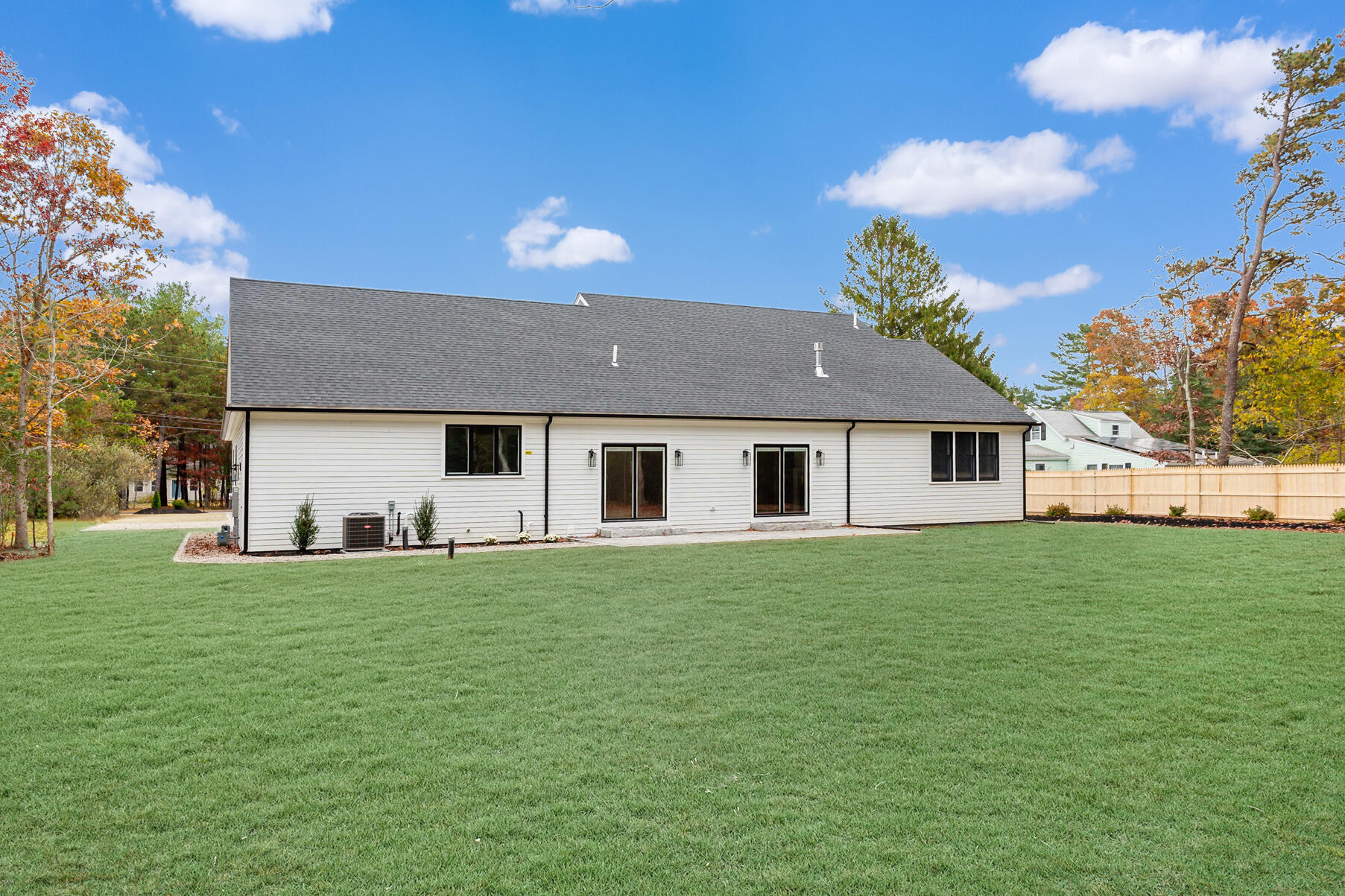 99 Orchard Road Mashpee, MA 02649 - Photo 34 of 49 a front view of a house with a garden