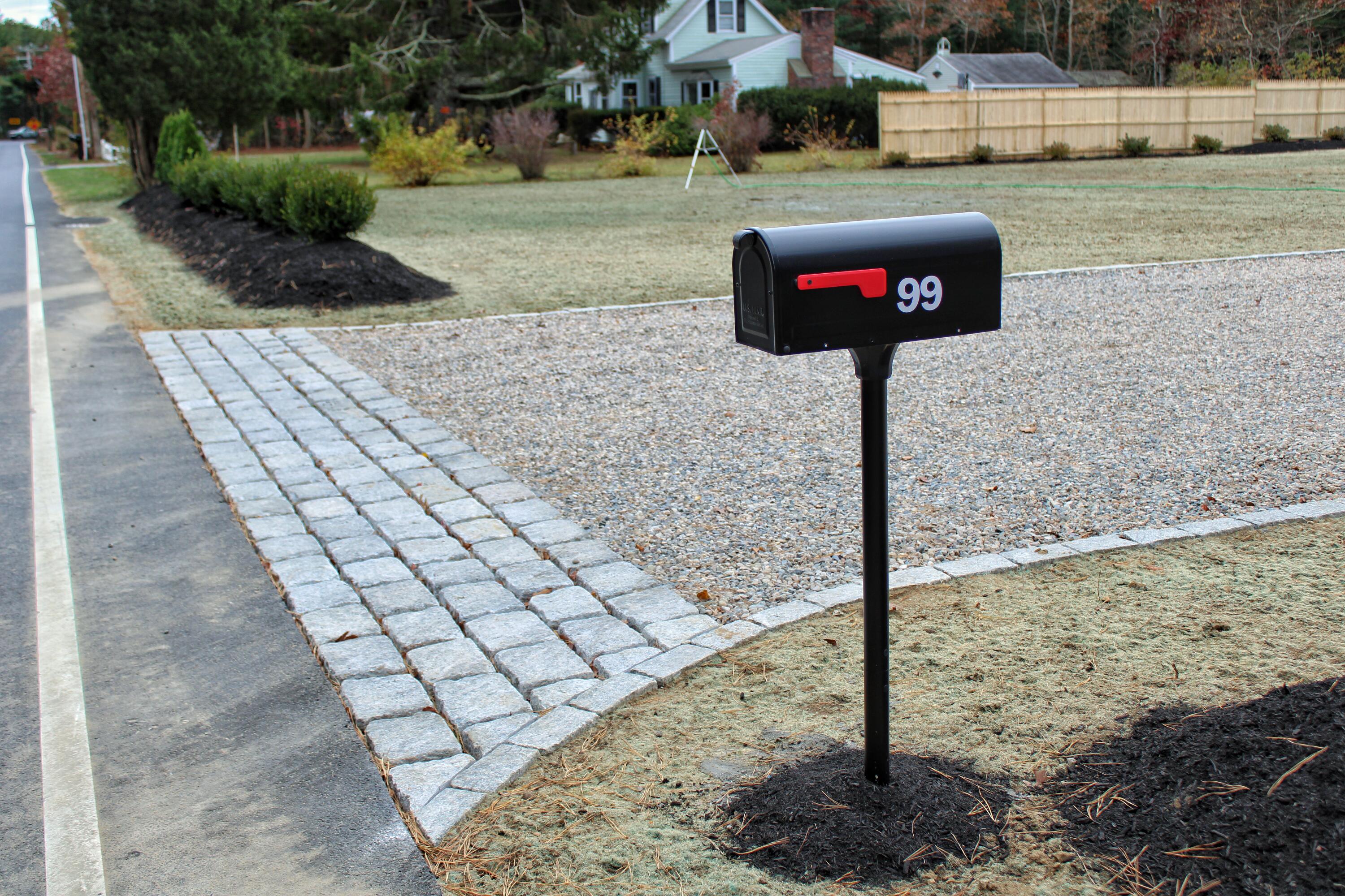 99 Orchard Road Mashpee, MA 02649 - Photo 37 of 49 a sign that is on the side of a road