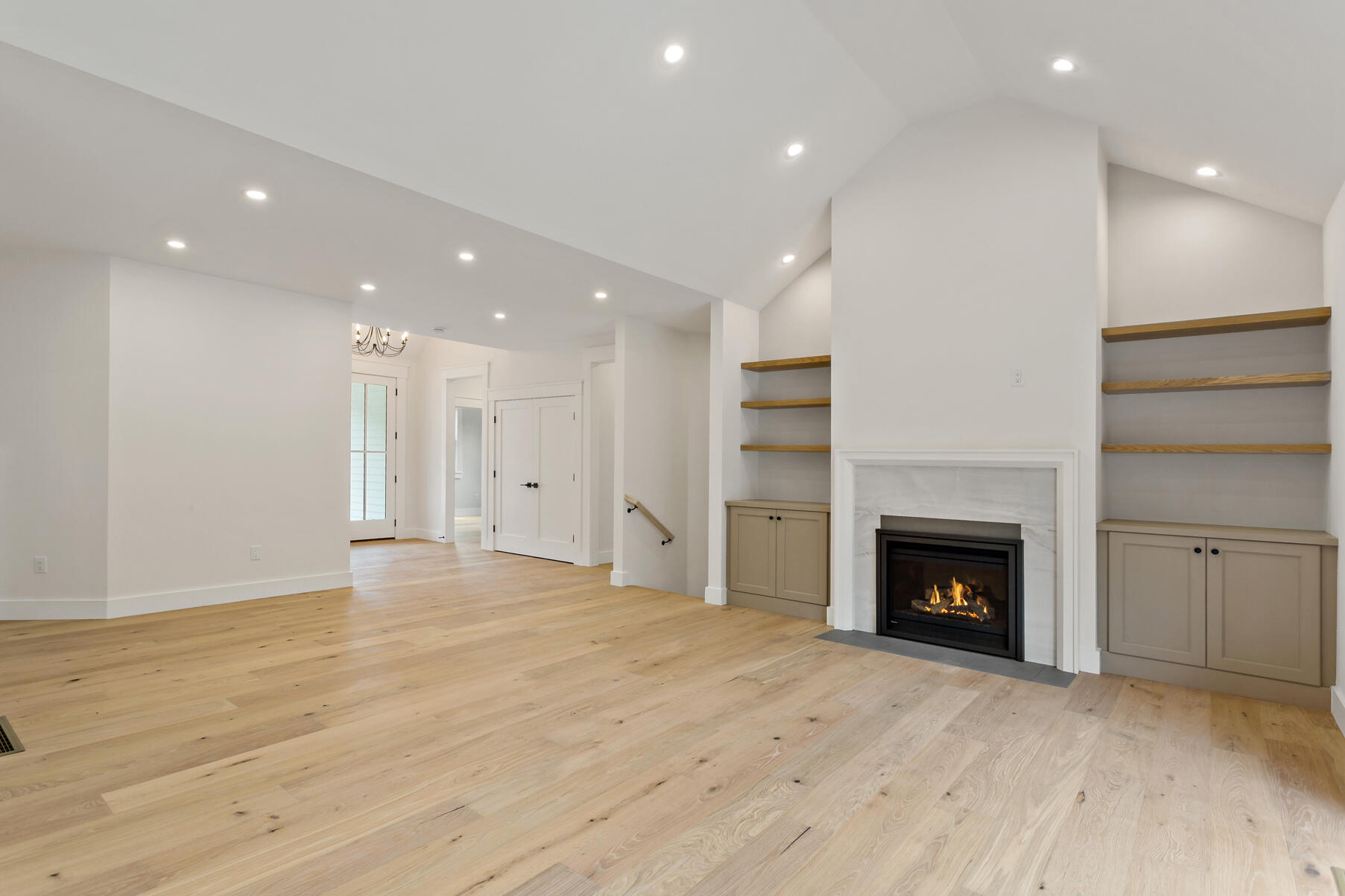 99 Orchard Road Mashpee, MA 02649 - Photo 9 of 49 a view of an empty room with a fireplace and a fireplace