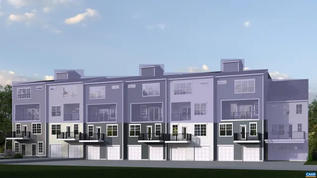 a front view of a building with street view and lake view