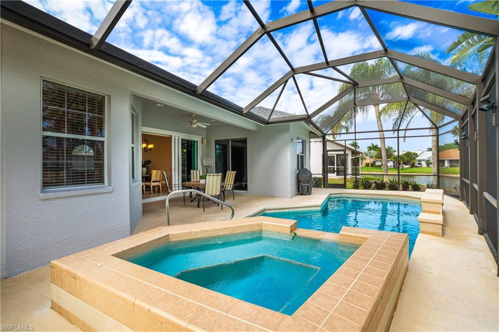 5235 Malvern Court Naples, FL 34112 - Photo 26 of 28 a view of swimming pool with outdoor seating