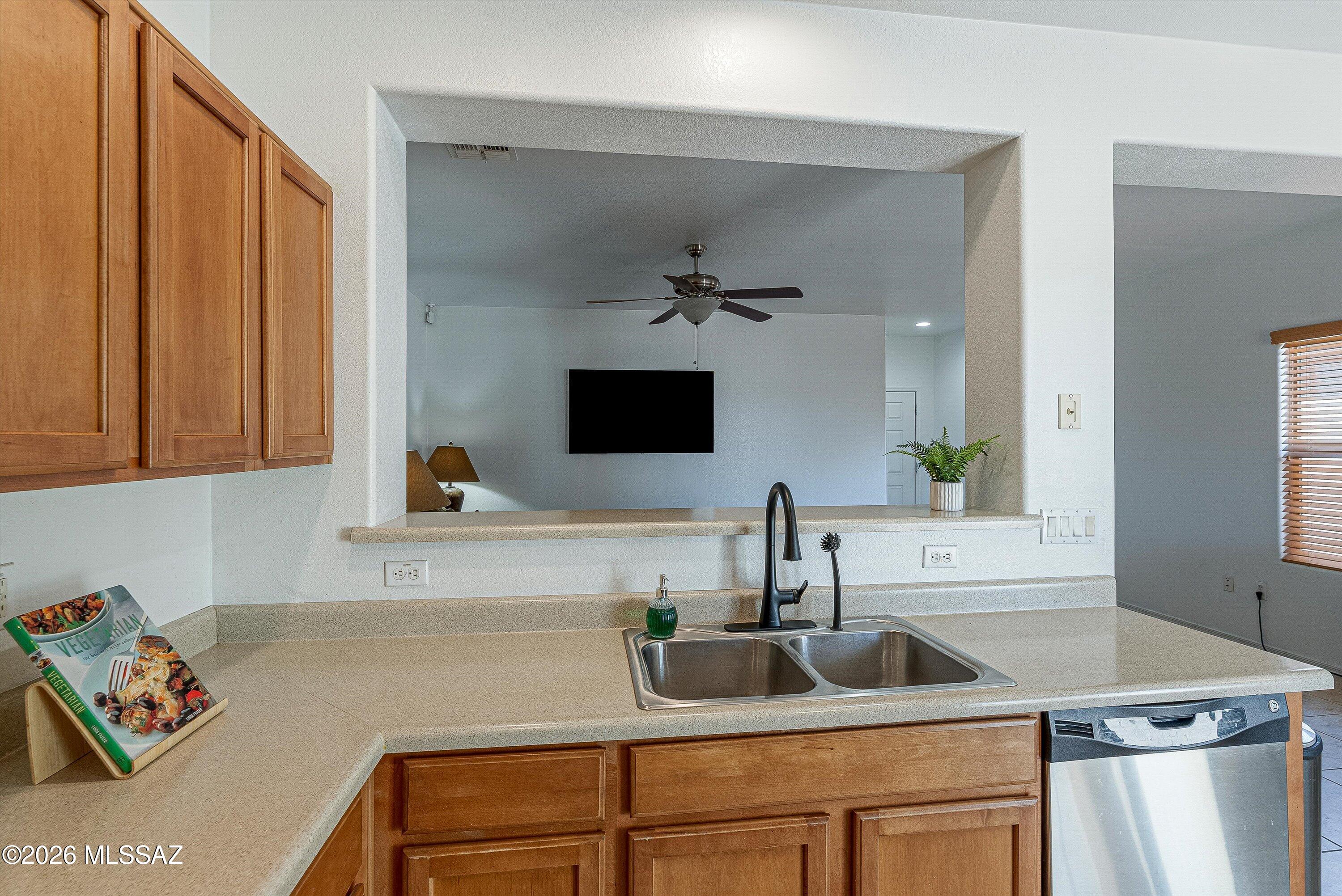 21163 East Treasure Road Red Rock, AZ 85145 - Photo 12 of 35 a kitchen with a sink and a refrigerator
