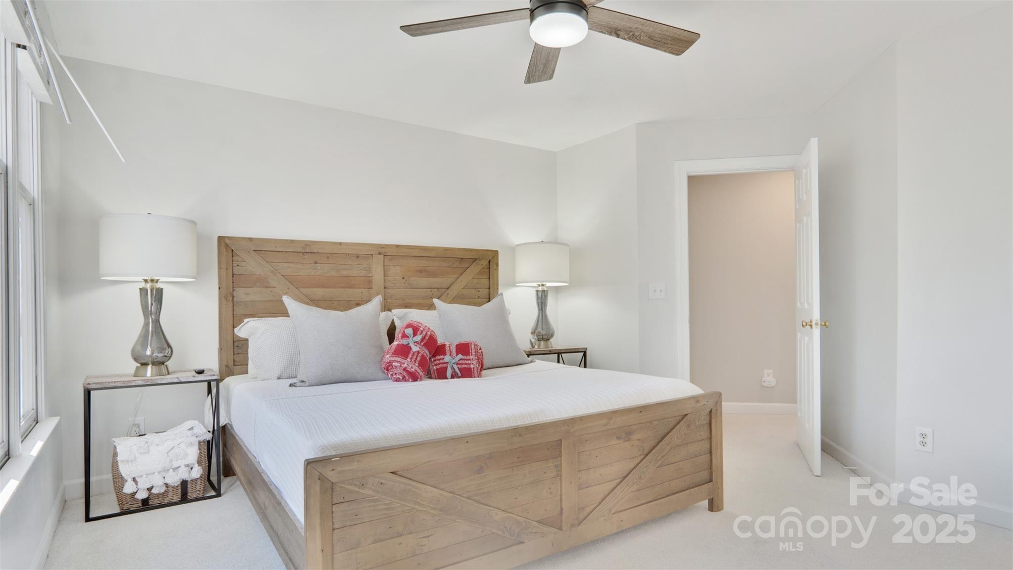 3309 Stettler View Road Charlotte, NC 28210 - Photo 13 of 29 a bedroom with a bed and a chandelier