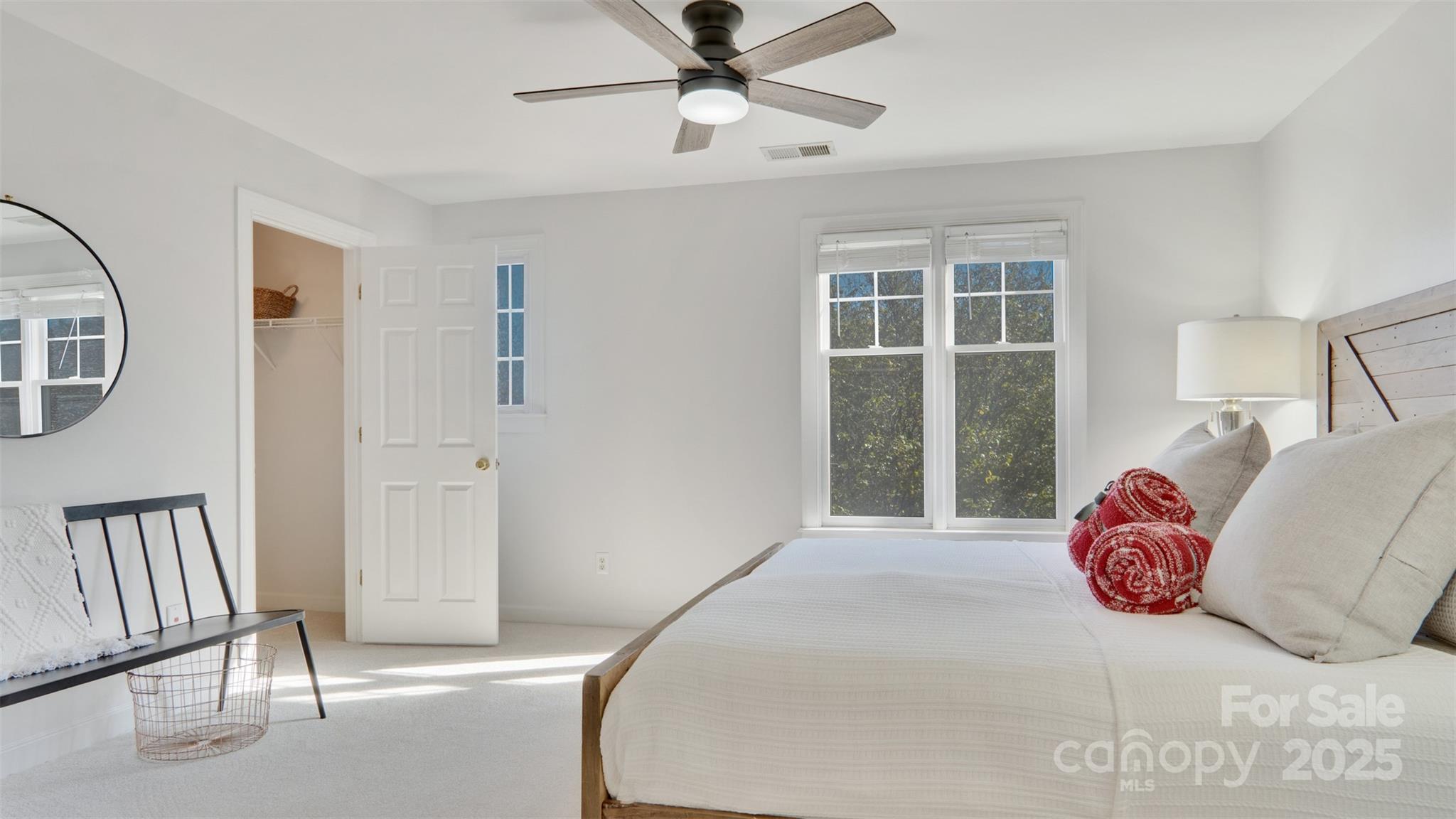3309 Stettler View Road Charlotte, NC 28210 - Photo 15 of 29 a bedroom with a large bed and a chandelier