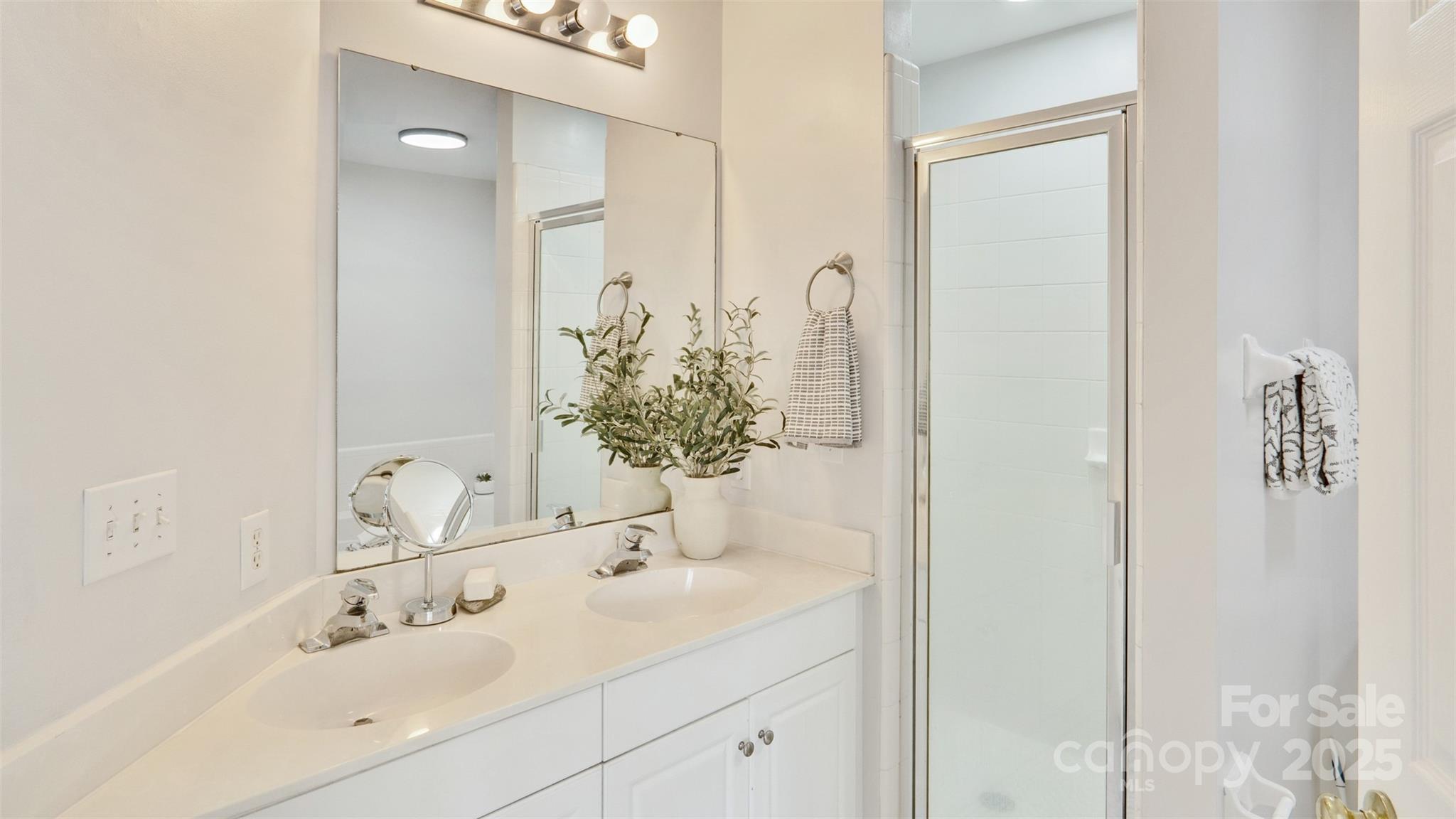 3309 Stettler View Road Charlotte, NC 28210 - Photo 17 of 29 a bathroom with a sink and a mirror