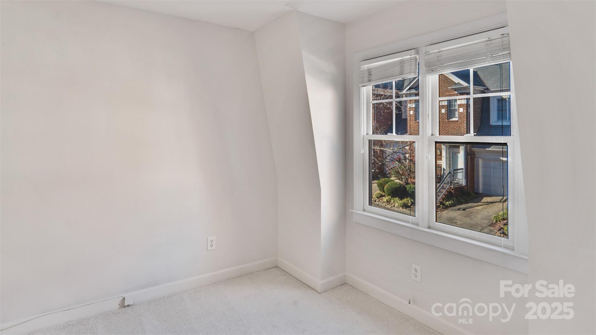 3309 Stettler View Road Charlotte, NC 28210 - Photo 21 of 29 a view of an empty room with a window
