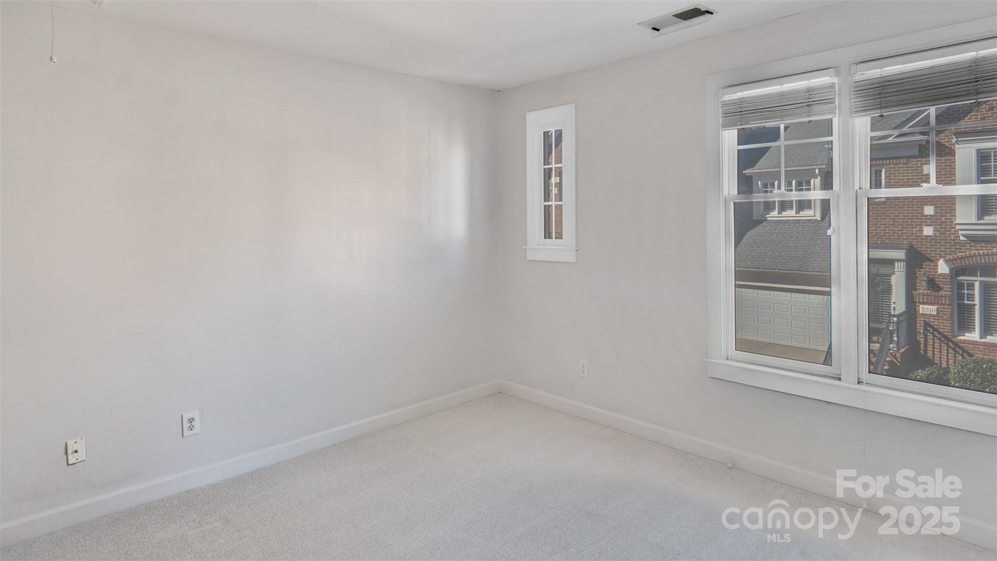 3309 Stettler View Road Charlotte, NC 28210 - Photo 26 of 29 an empty room with a window