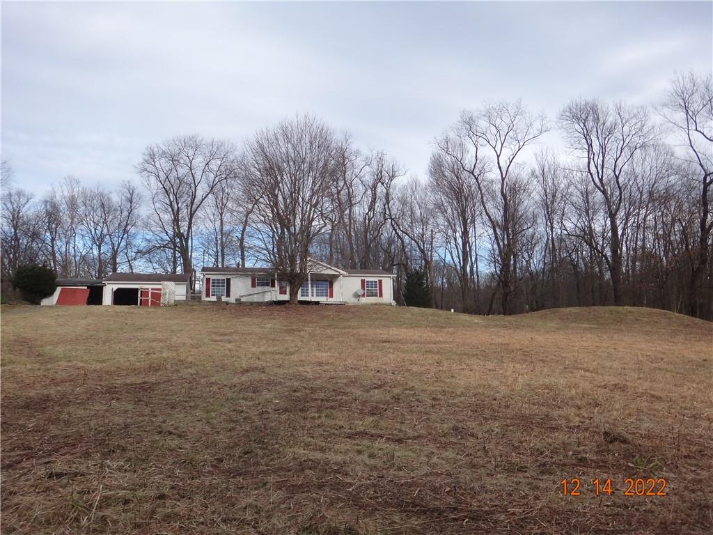 471 Millburn Road Mercer, PA 16137 - Photo 23 of 24 a house with trees in front of it