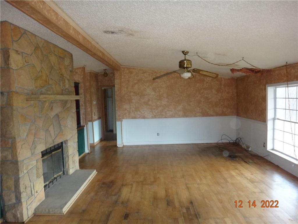 471 Millburn Road Mercer, PA 16137 - Photo 3 of 24 wooden floor in an empty room with a fireplace
