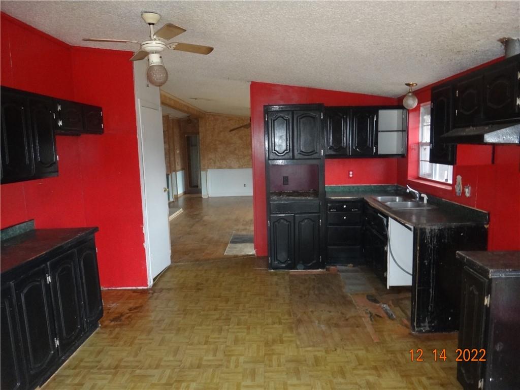 471 Millburn Road Mercer, PA 16137 - Photo 4 of 24 a kitchen with stainless steel appliances granite countertop a stove a sink and a refrigerator