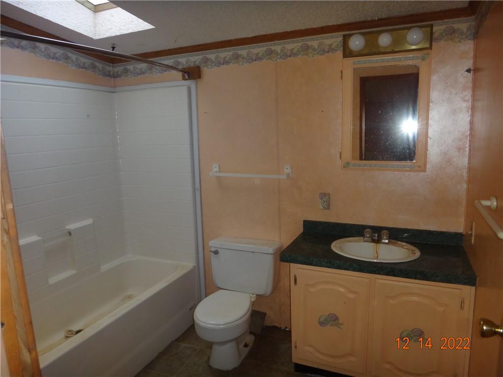 471 Millburn Road Mercer, PA 16137 - Photo 10 of 24 a bathroom with a granite countertop sink toilet and shower