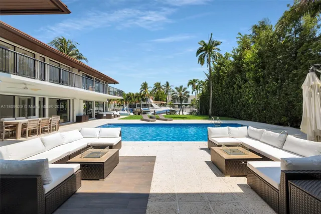 a view of house with couch and chairs