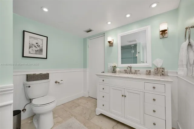 a view of a livingroom with furniture and a potted plant
