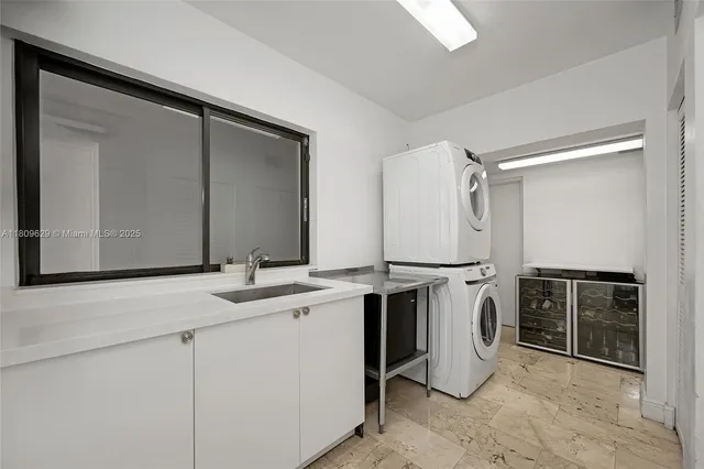 a bedroom with a bed and glass walk in closet