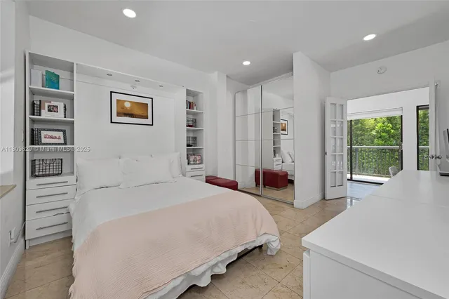 a living room with furniture and a book shelf