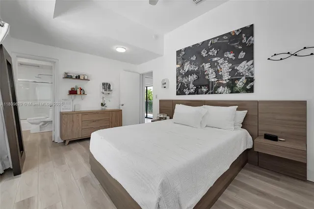 a bedroom with a bed and a couch