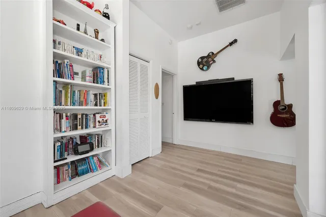 a bedroom with bed and window