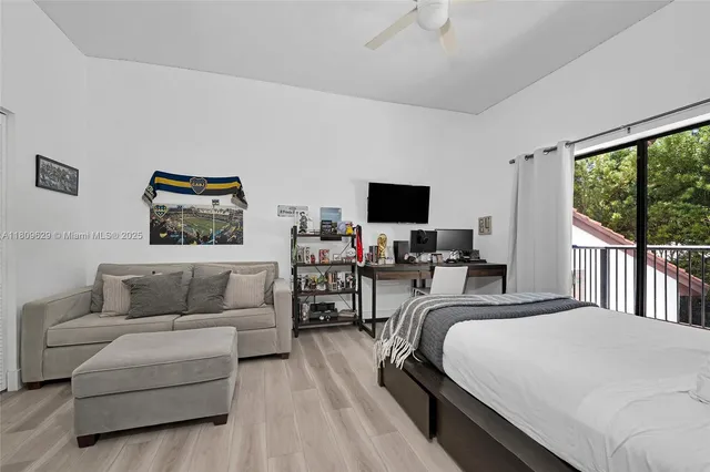 a large bathroom with a sink a mirror and a shower