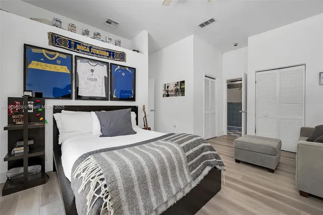 a front view of a house with garden and swimming pool