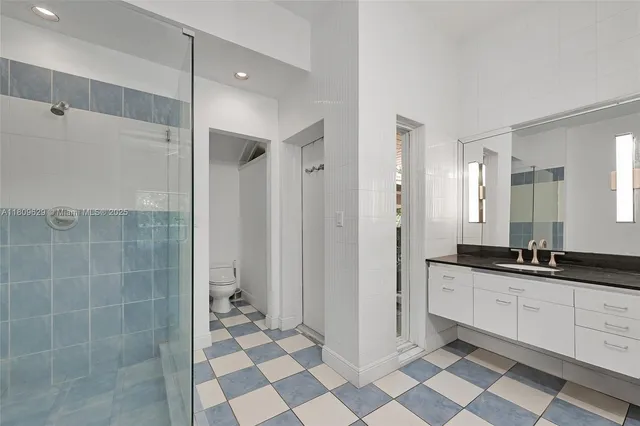 a view of a house with swimming pool and sitting area