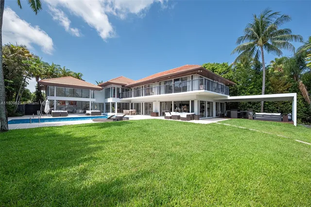 a view of a lake with boats and trees around
