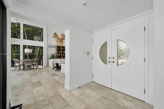 a view of a livingroom with furniture and white walls